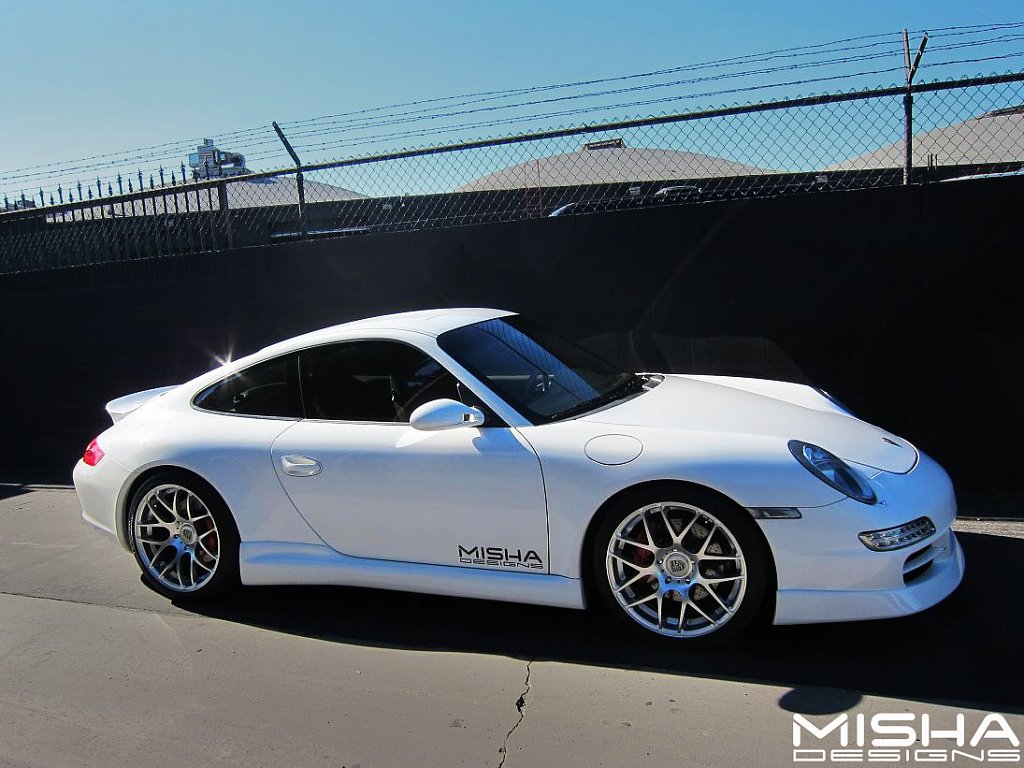 Click image for larger version

Name:	Porsche-997-front-bumper-lip-Misha-Designs-white-6.jpg
Views:	1845
Size:	253.2 KB
ID:	255846