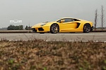 Click image for larger version

Name:	YellowAventadorRS045_zps46354236.jpg
Views:	687
Size:	60.3 KB
ID:	326822