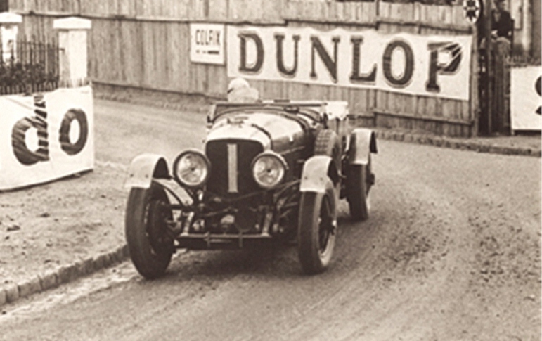 1929: ‘Old Number 1’ won the Six Hour Race at Brooklands and finshed first at Le Mans, where Bentleys swept the top four places. Frank Clement and Jack Barclay won the 500 mile race at Brooklands. 1930: ‘Old Number 1’ again wins Le Mans. Sir Henry Birkin finishes an impressive 2nd in the French Grand Prix. 1931: Bentley is acquired by Rolls-Royce. ‘Old Number 1’ wins another 500 mile race at the Brooklands.