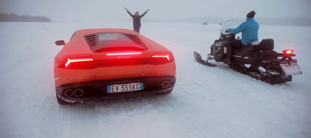 Watch the Lamborghini Huracan Race a Snowmobile