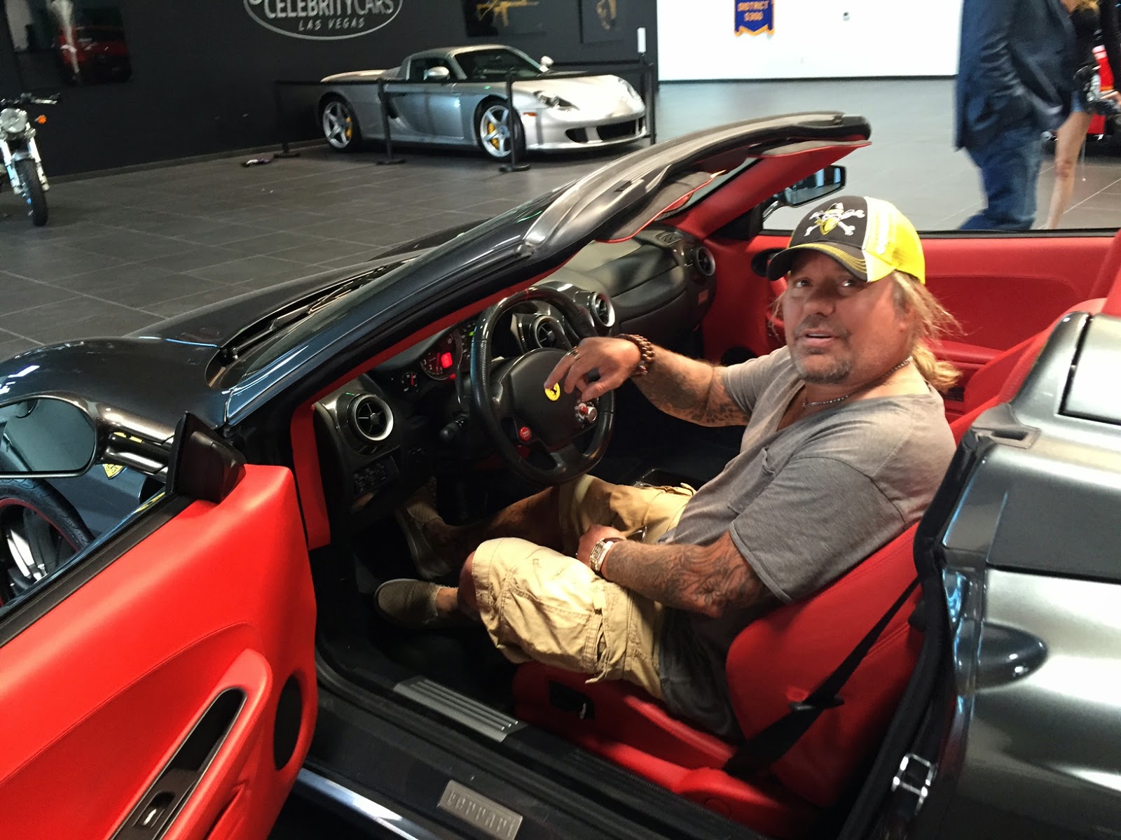 Vince Neil behind the wheel of a Ferrari.