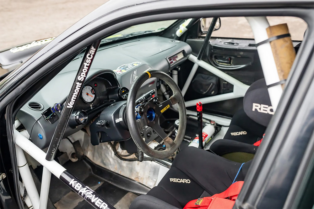 Interior of former Ken Block driven Vermont SportsCar built Subaru Impreza 2.5 RS rally car with roll cage
