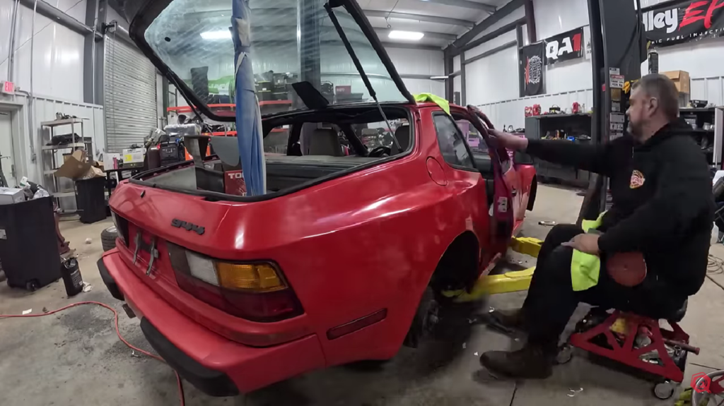 A red Porsche 944 and The Questionable Garage