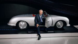 Dr. Wolfgang Porsche sitting in Porsche 356