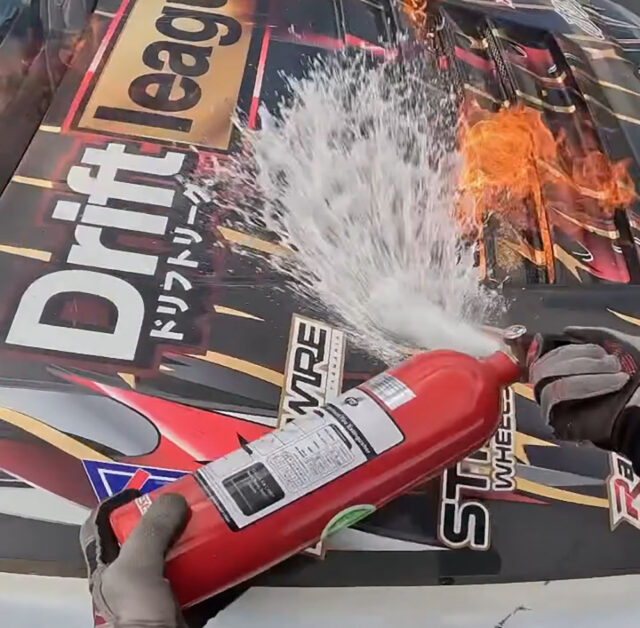 Brodie Maher, professional drifting driver attempts to extinguish a fuel fire in during practice at D1NZ in his SR20 Powered S13
