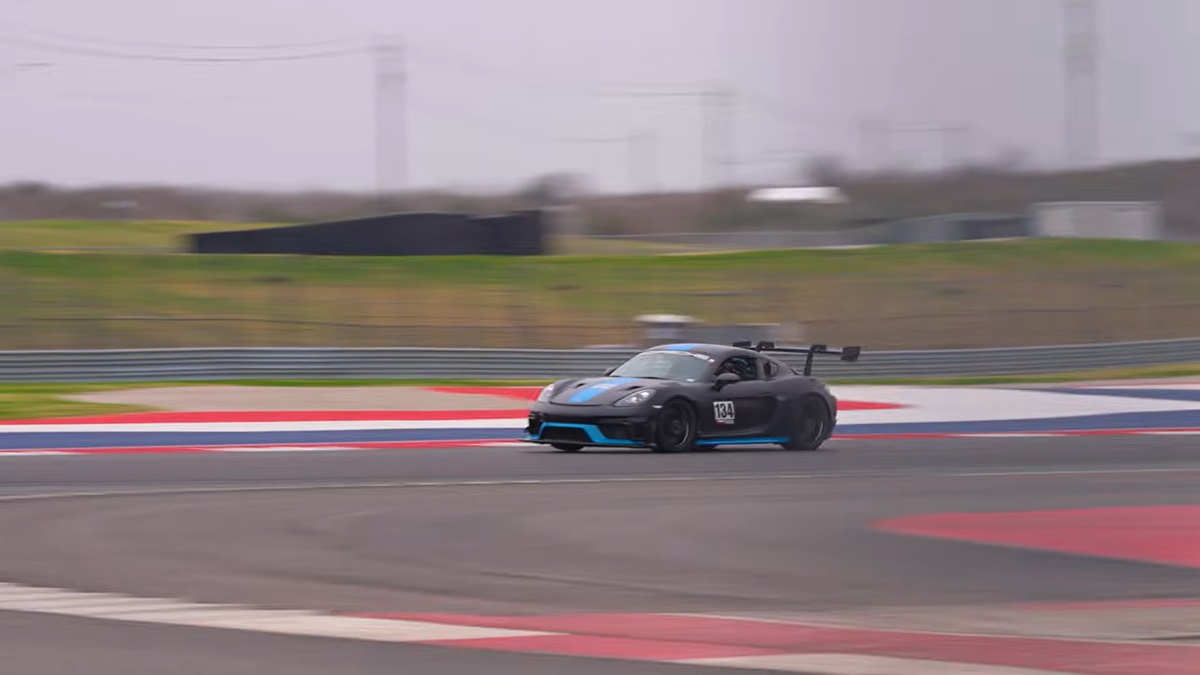 A Porsche 718 Cayman GT4 RS chases a 911 GT3 RS at COTA.