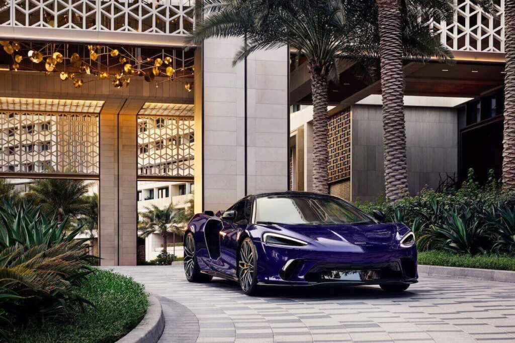 An OpenAI executive and her husband are suing McLaren over mansion party fines.