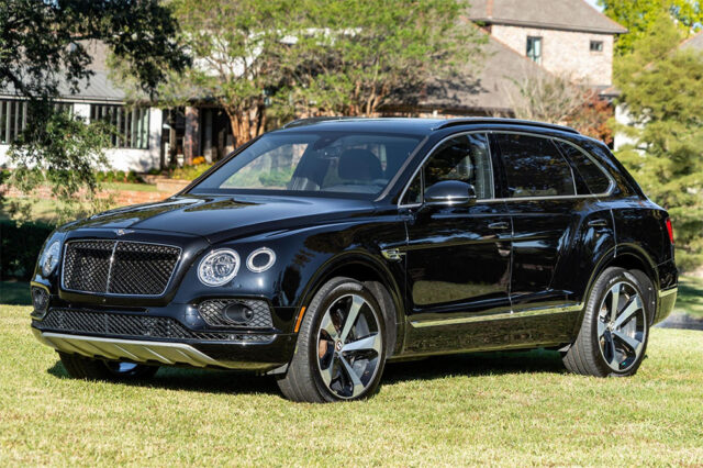 2018 Bentley Bentayga Onyx Black Cars and Bids Auction front 3/4 parked on grass